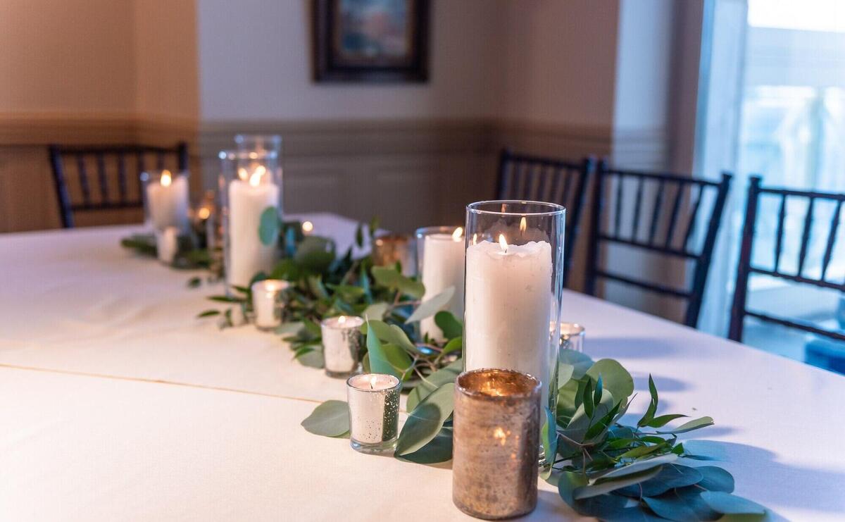 Beautiful elegant wedding table set up decorated with flower compositions and candles