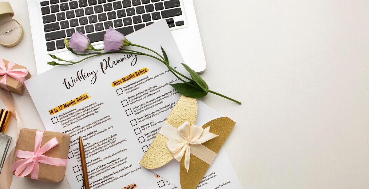 Modern wedding planner and laptop copy space