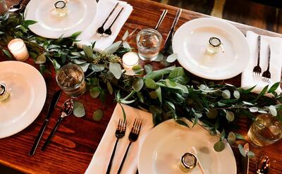 white ceramic dinner plate set on brown wooden table