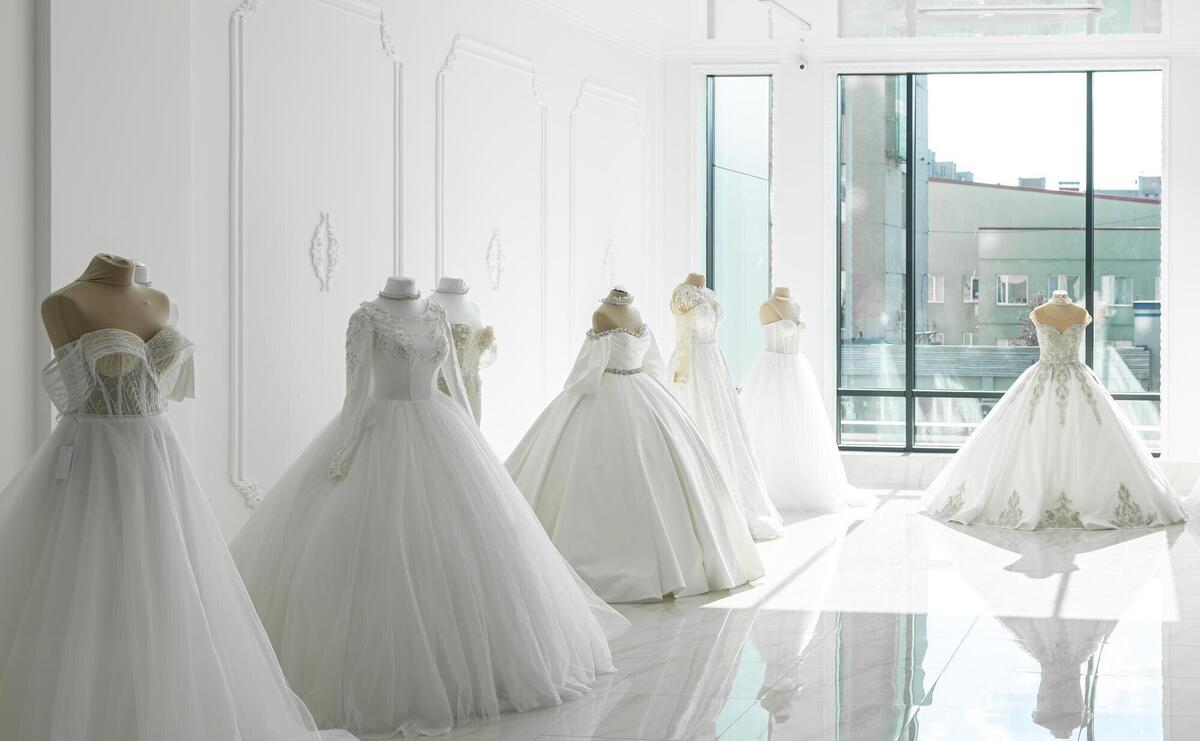 Beautiful wedding bridal dresses on mannequin in showroom in mall