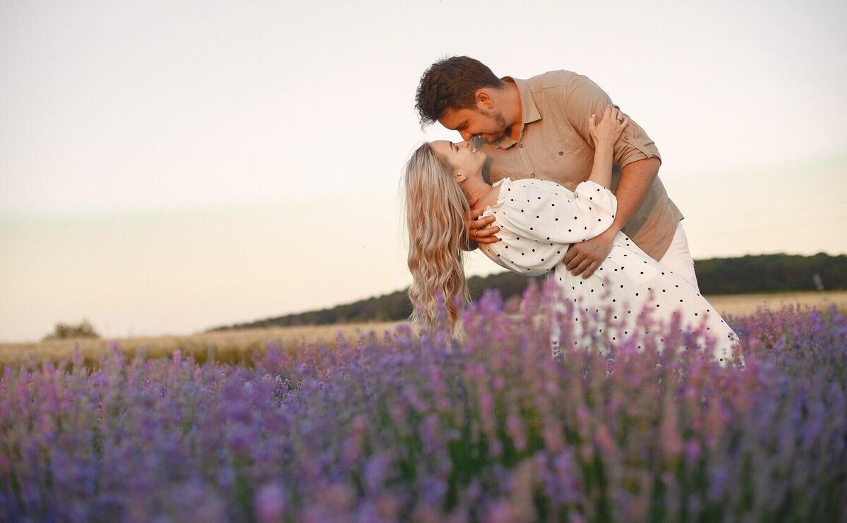 Provence couple relaxing in lavender field. lady in a white dress.